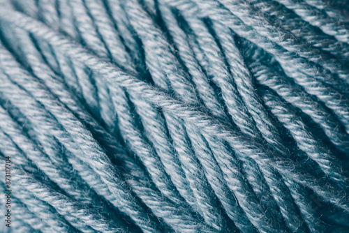 A close up of a blue yarn with a fuzzy texture