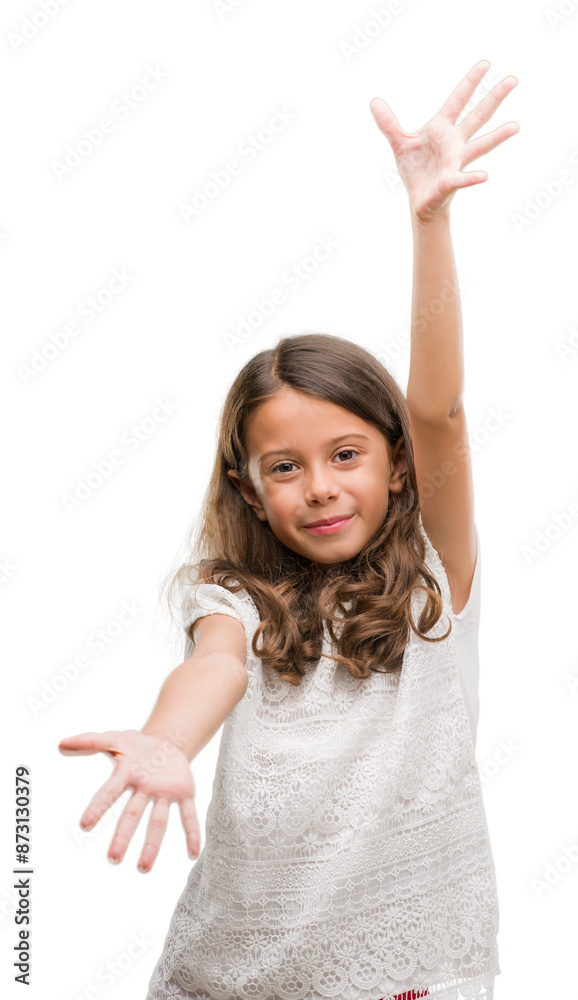 Brunette hispanic girl looking at the camera smiling with open arms for hug. Cheerful expression embracing happiness. Brunette hispanic girl looking at the camera smiling with open arms for hug. Cheerful expression embracing happiness.