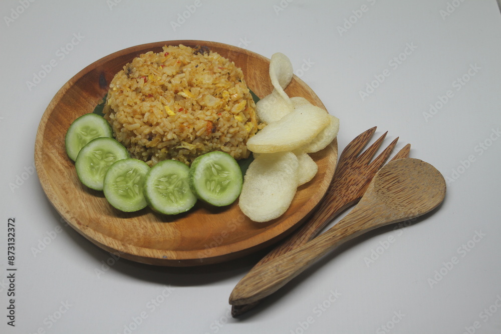 Chinese Asian Egg and Vegetable Fried Rice on Wooden Plate on White Background.
Chinese Asian Egg and Vegetable Fried Rice on Wooden Plate on White Background.