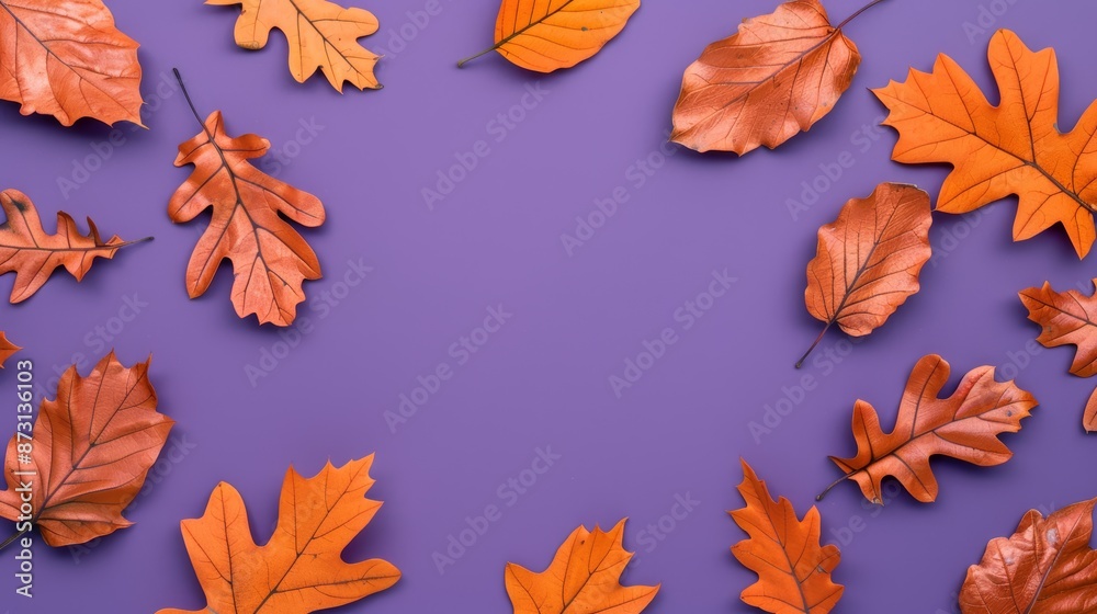 Fototapeta premium Pattern of dry orange metallic leaves on violet background, focus cover all object, deep dept of field