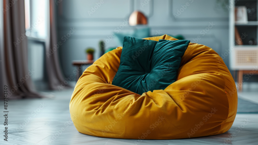 Yellow beanbag chair with green pillows in a modern living room. Yellow beanbag chair with green pillows in a modern living room.