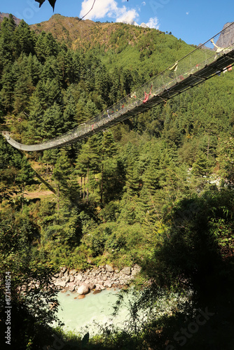 The long metal suspension bridge leading form Phakding to Sano Gemela, Gumela, Mount Everest Base Camp Trek, EBC, Nepal photo