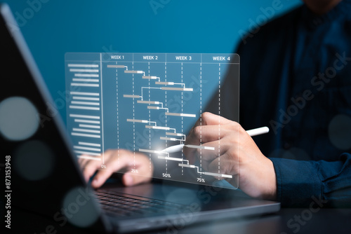 Manager or Site engineer makes project proceeding report concept. Plant management by planning software to generate Gantt chart schedules for updating construction progress and operations plan tasks.