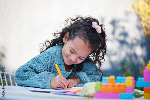 Vászonkép Young girl, playing and colorful workbook in home for growth, child development and learning for motor skills