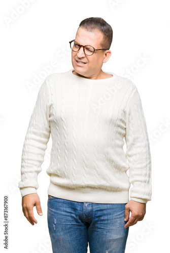 Middle age arab man wearing glasses over isolated background winking looking at the camera with sexy expression, cheerful and happy face.