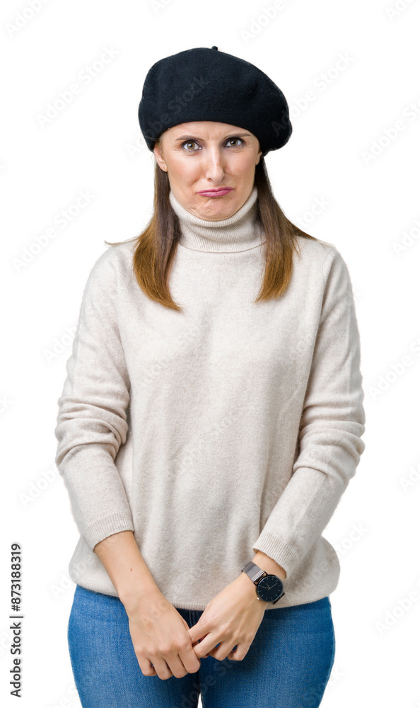 Middle age mature woman wearing winter sweater and beret over isolated background depressed and worry for distress, crying angry and afraid. Sad expression. Middle age mature woman wearing winter sweater and beret over isolated background depressed and worry for distress, crying angry and afraid. Sad expression.