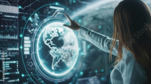 A woman in a white lab coat uses a futuristic touch screen interface to display a holographic globe of the Earth.