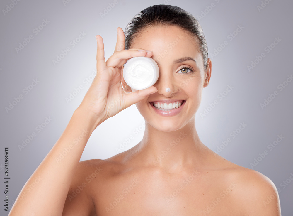 Woman, portrait and cream jar for skincare with natural shine, facial glow and collagen in studio. Model, dermatology and lotion container with sunscreen, anti aging and moisture by gray background