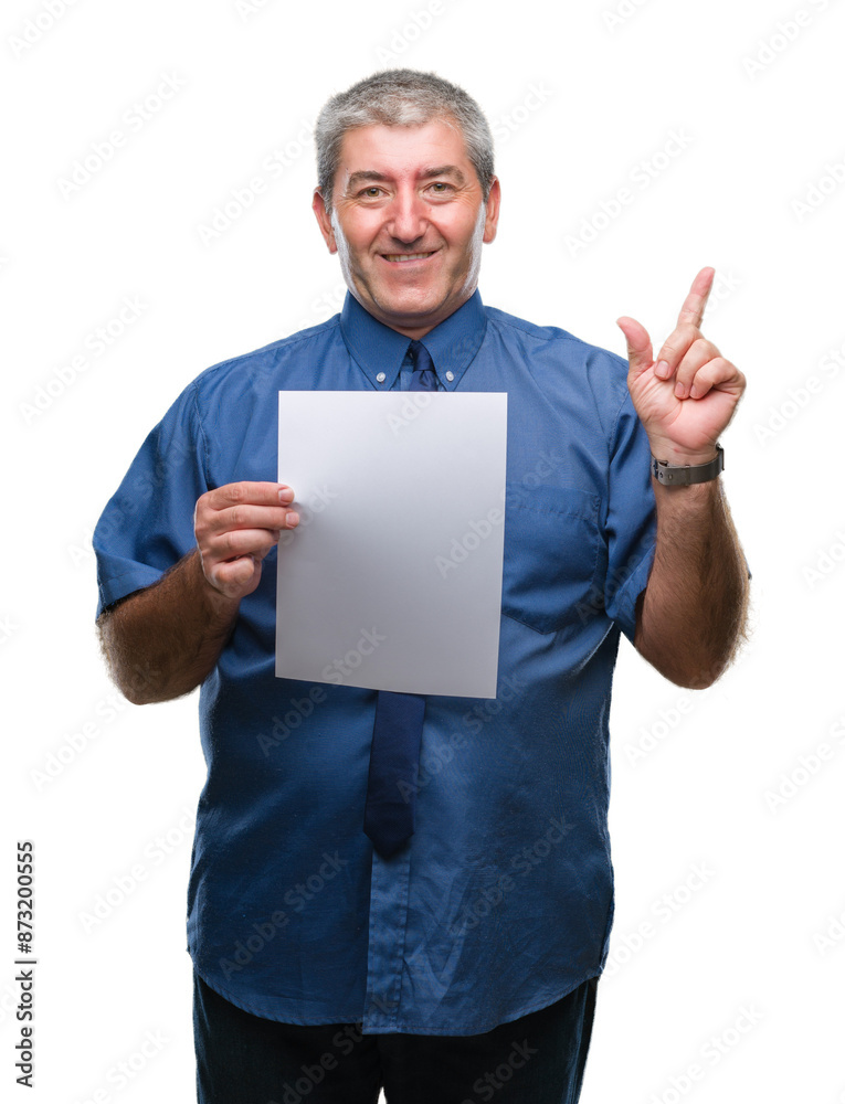 Handsome senior man holding blank sheet paper over isolated background very happy pointing with hand and finger to the side Handsome senior man holding blank sheet paper over isolated background very happy pointing with hand and finger to the side