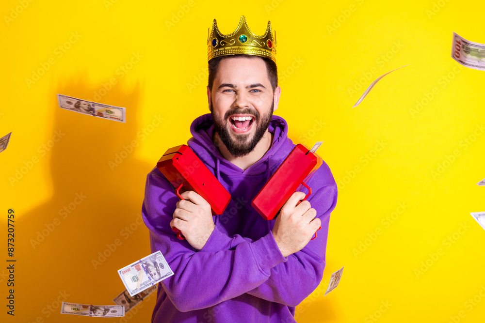 Photo of cheerful overjoyed man wear purple stylish clothes glad wealth isolated on yellow color background