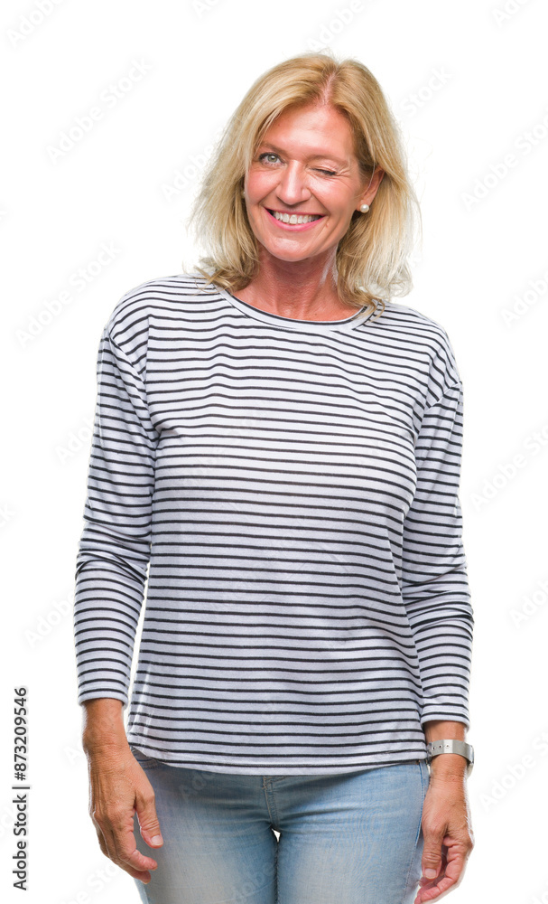 Middle age blonde woman over isolated background winking looking at the camera with sexy expression, cheerful and happy face. Middle age blonde woman over isolated background winking looking at the camera with sexy expression, cheerful and happy face.