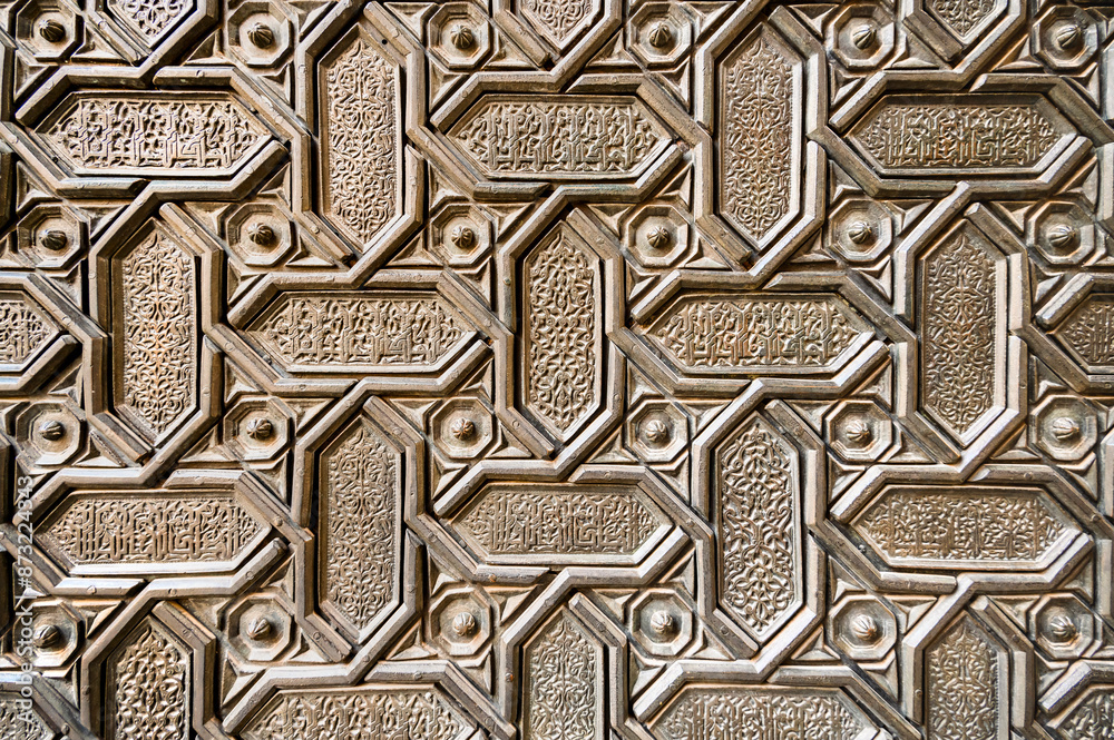 Background of ordered metal geometric elements with patterns and oriental script Background of ordered metal geometric elements with patterns and oriental script
