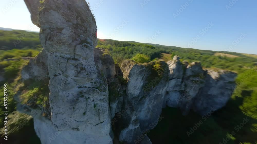Cinematic FPV flight through a hole in the limestone rock of the picturesque Jurassic highlands in Poland Cinematic FPV flight through a hole in the limestone rock of the picturesque Jurassic highlands in Poland