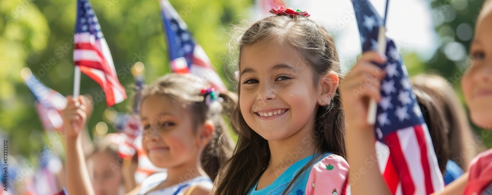 Smiling children holding American flags in a patriotic parade celebrating national pride and unity on a sunny day. Smiling children holding American flags in a patriotic parade celebrating national pride and unity on a sunny day.