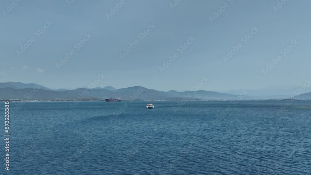 Aerial view of a moored yacht boat in beautiful calm sea bay with turquoise water near Fethiye, Turkey. Full circle around luxury Aerial view of a moored yacht boat in beautiful calm sea bay with turquoise water near Fethiye, Turkey. Full circle around luxury