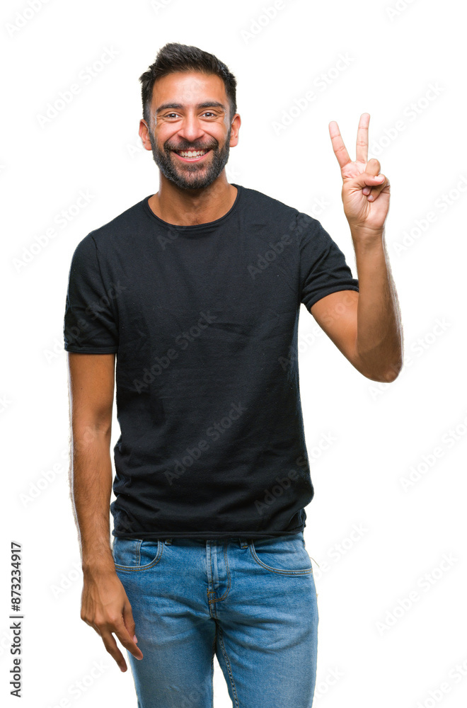 Adult hispanic man over isolated background smiling with happy face winking at the camera doing victory sign. Number two. Adult hispanic man over isolated background smiling with happy face winking at the camera doing victory sign. Number two.