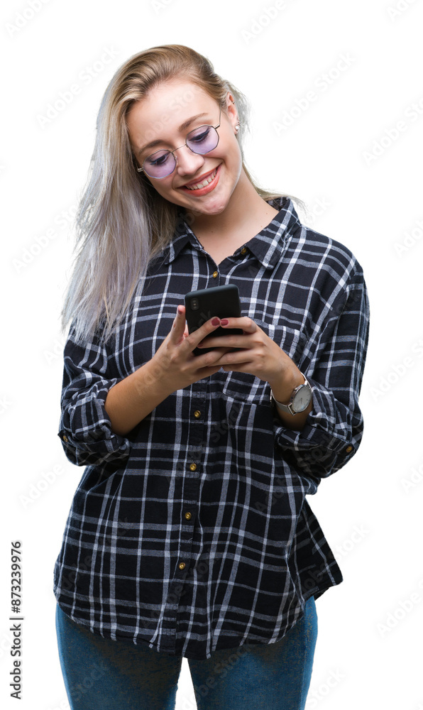 Young blonde woman texting sending message using smartphone over isolated background with a happy face standing and smiling with a confident smile showing teeth Young blonde woman texting sending message using smartphone over isolated background with a happy face standing and smiling with a confident smile showing teeth
