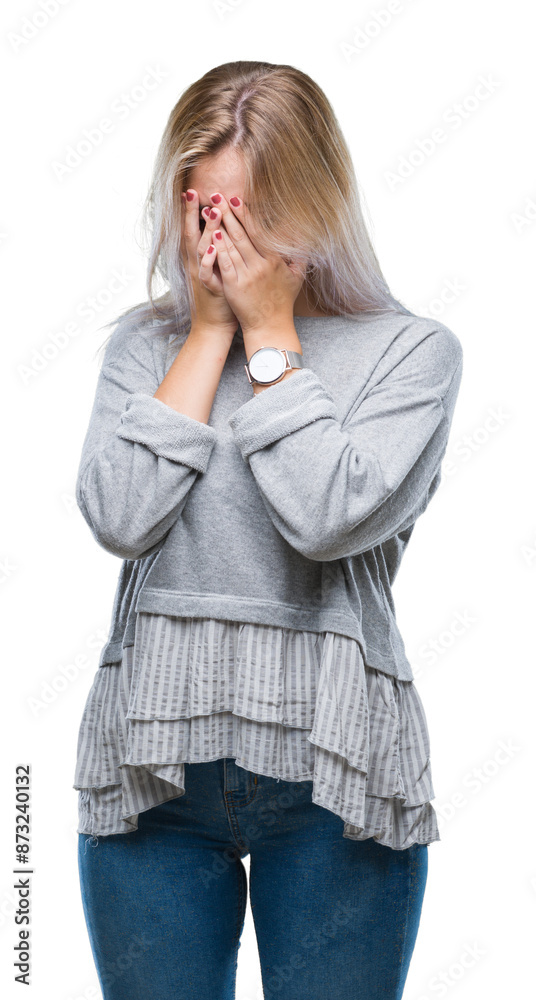 Young blonde woman over isolated background with sad expression covering face with hands while crying. Depression concept. Young blonde woman over isolated background with sad expression covering face with hands while crying. Depression concept.