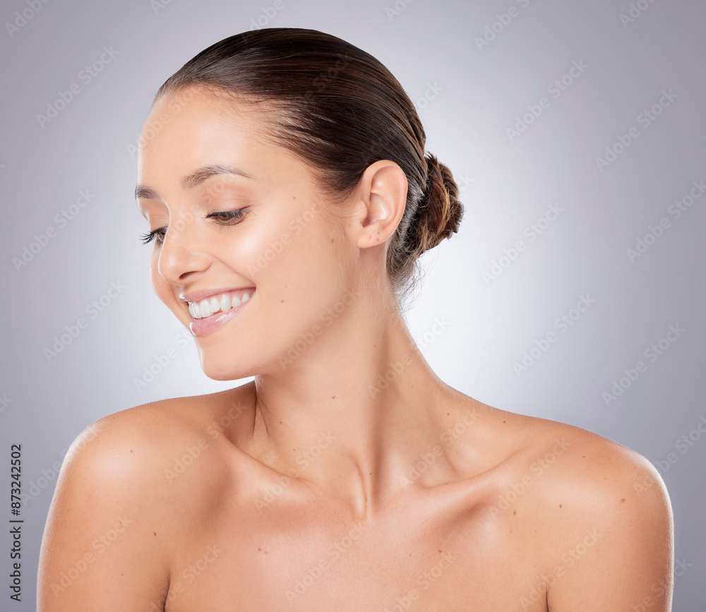 Woman, beauty and happy for skincare in studio with natural makeup, health and facial glow. Model girl, smile and dermatology for skin transformation, spa aesthetic and self care by gray background Woman, beauty and happy for skincare in studio with natural makeup, health and facial glow. Model girl, smile and dermatology for skin transformation, spa aesthetic and self care by gray background
