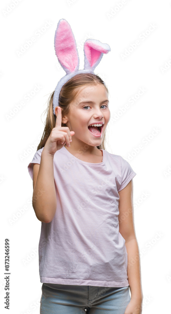 Young beautiful girl wearing easter bunny ears over isolated background pointing finger up with successful idea. Exited and happy. Number one. Young beautiful girl wearing easter bunny ears over isolated background pointing finger up with successful idea. Exited and happy. Number one.