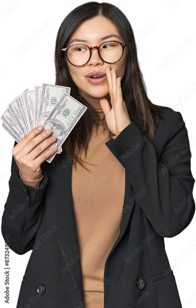 Chinese businesswoman with dollar bills is saying a secret hot braking news and looking aside