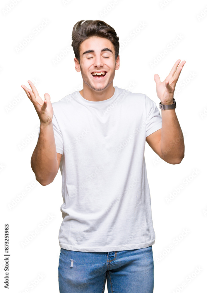 Young handsome man wearing white t-shirt over isolated background celebrating mad and crazy for success with arms raised and closed eyes screaming excited. Winner concept Young handsome man wearing white t-shirt over isolated background celebrating mad and crazy for success with arms raised and closed eyes screaming excited. Winner concept
