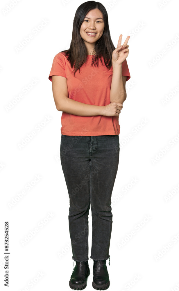Full-body young Chinese woman showing number two with fingers. Full-body young Chinese woman showing number two with fingers.