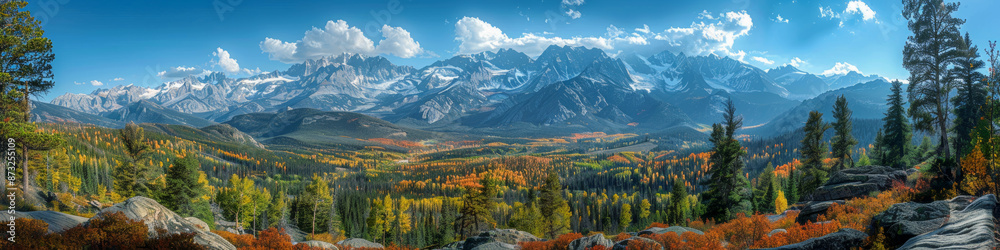 Fototapeta premium Stunning Panoramic View of Vibrant Autumn Landscapes and Snow Capped Mountain Range