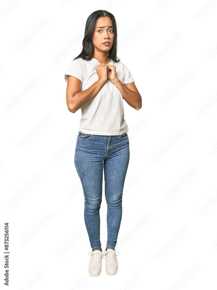 Full body shot of Latina in studio scared and afraid. Full body shot of Latina in studio scared and afraid.