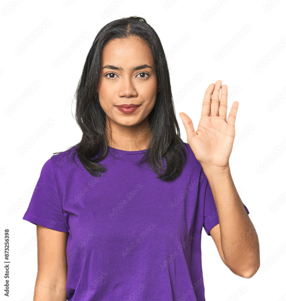 Young Latina posing in studio smiling cheerful showing number five with fingers. Young Latina posing in studio smiling cheerful showing number five with fingers.