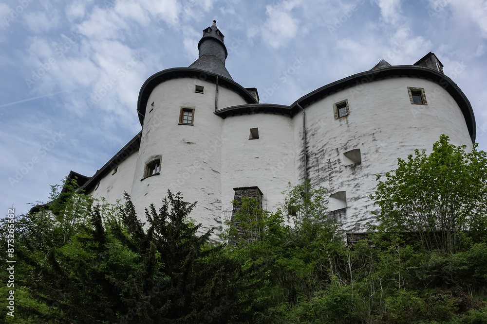 View of Clervaux Castle (Chateau de Clervaux) in Clervaux in Northern Luxembourg, dates back to XII century. Castle stands at a height of 365 meters on a rocky spur above town. Clervaux, Luxembourg. View of Clervaux Castle (Chateau de Clervaux) in Clervaux in Northern Luxembourg, dates back to XII century. Castle stands at a height of 365 meters on a rocky spur above town. Clervaux, Luxembourg.