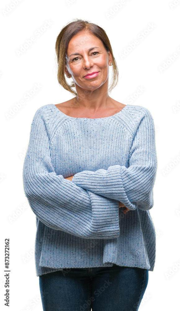 Middle age senior hispanic woman wearing winter sweater over isolated background happy face smiling with crossed arms looking at the camera. Positive person. Middle age senior hispanic woman wearing winter sweater over isolated background happy face smiling with crossed arms looking at the camera. Positive person.