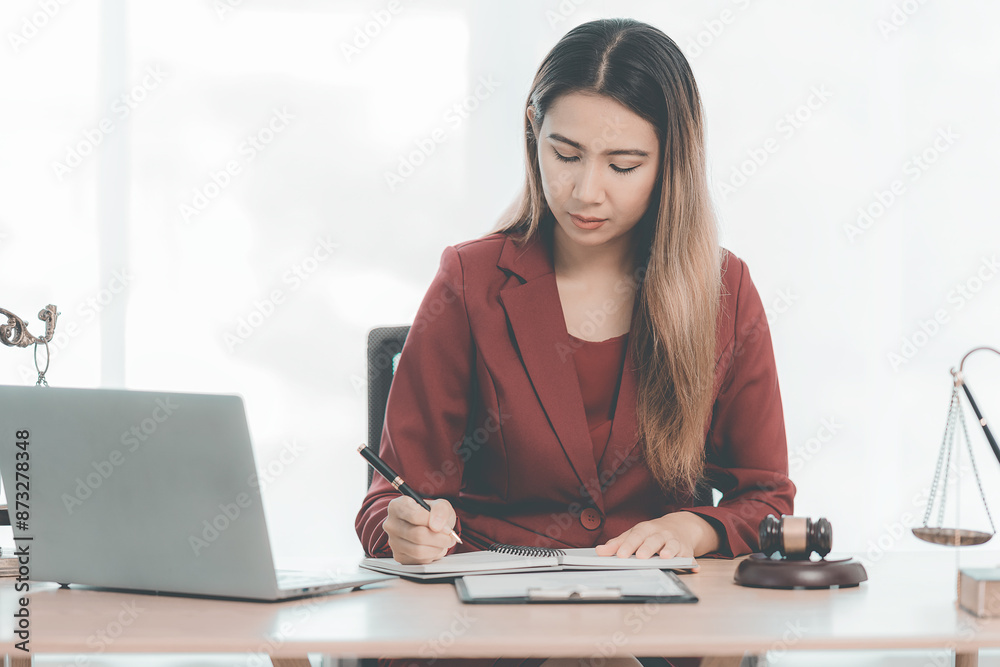Female lawyer working in office or court Verify customer contract with statue of Themis, goddess of justice. online legal advice Female lawyer working in office or court Verify customer contract with statue of Themis, goddess of justice. online legal advice