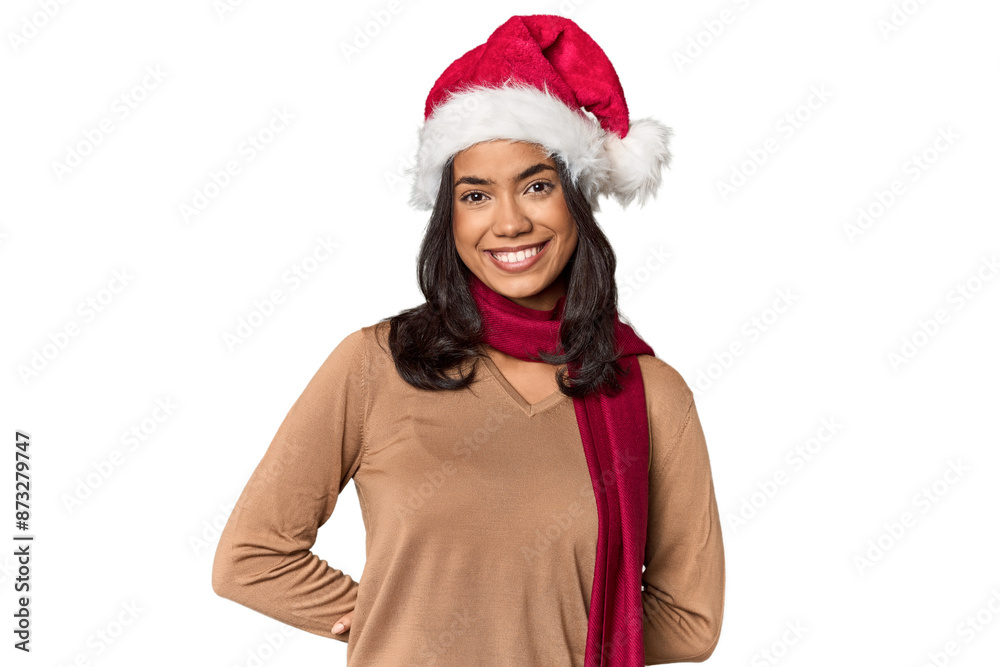 Young Filipino woman in Santa hat, festive mood Young Filipino woman in Santa hat, festive mood