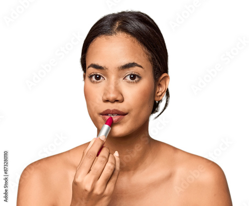 Filipino woman applying lipstick, beauty touch