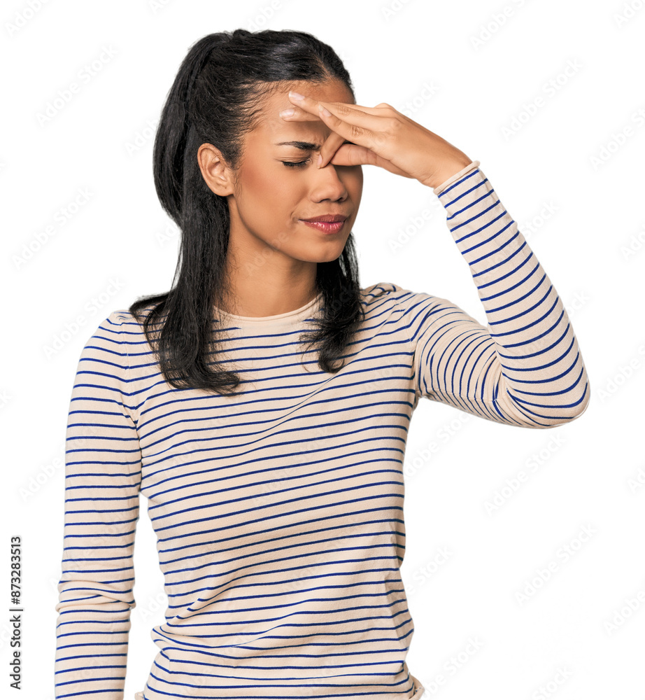 Young Filipina woman having a head ache, touching front of the face. Young Filipina woman having a head ache, touching front of the face.