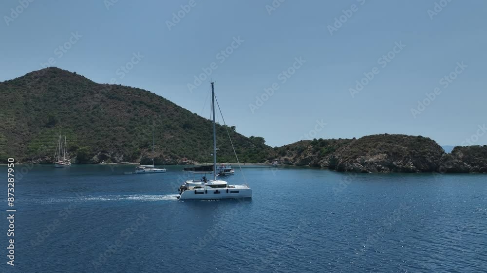 Aerial view of a moored yacht boat in beautiful calm sea bay with turquoise water near Fethiye, Turkey. Full circle around luxury Aerial view of a moored yacht boat in beautiful calm sea bay with turquoise water near Fethiye, Turkey. Full circle around luxury