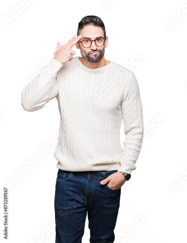 Young handsome man wearing glasses over isolated background Shooting and killing oneself pointing hand and fingers to head, suicide gesture.