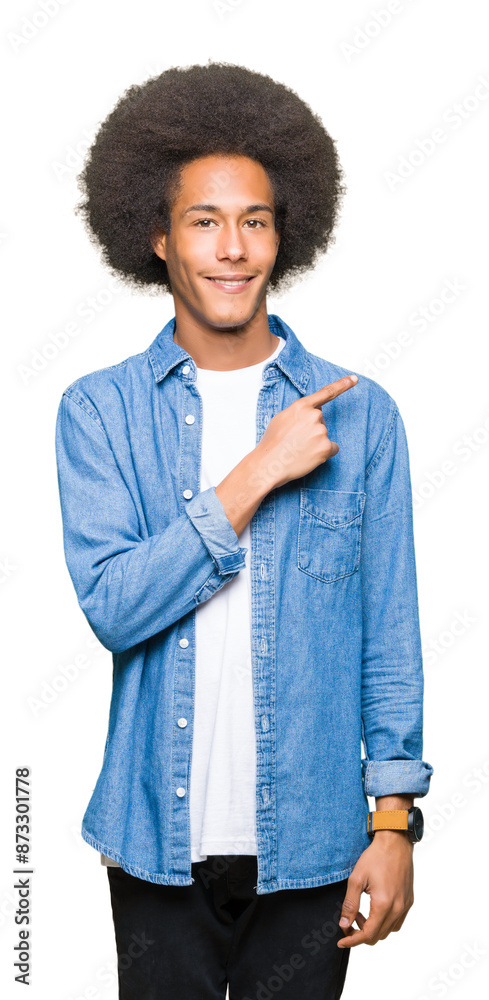 Young african american man with afro hair cheerful with a smile of face pointing with hand and finger up to the side with happy and natural expression on face Young african american man with afro hair cheerful with a smile of face pointing with hand and finger up to the side with happy and natural expression on face