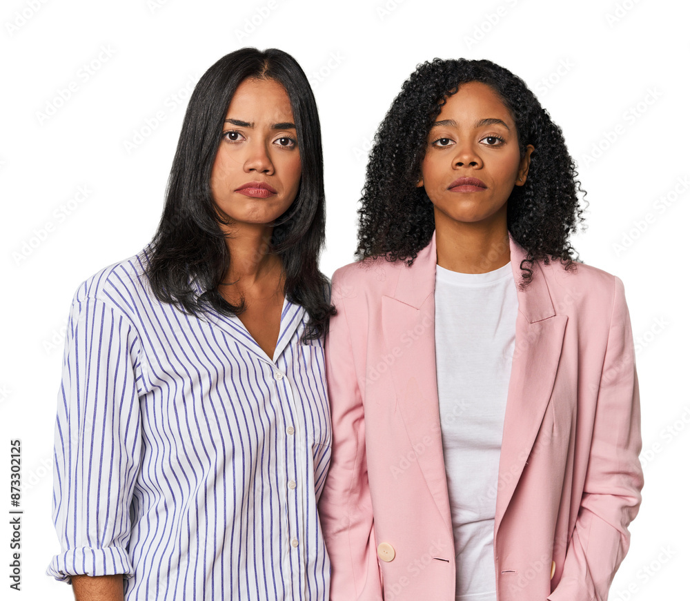 Young Latin businesswomen in studio sad, serious face, feeling miserable and displeased.