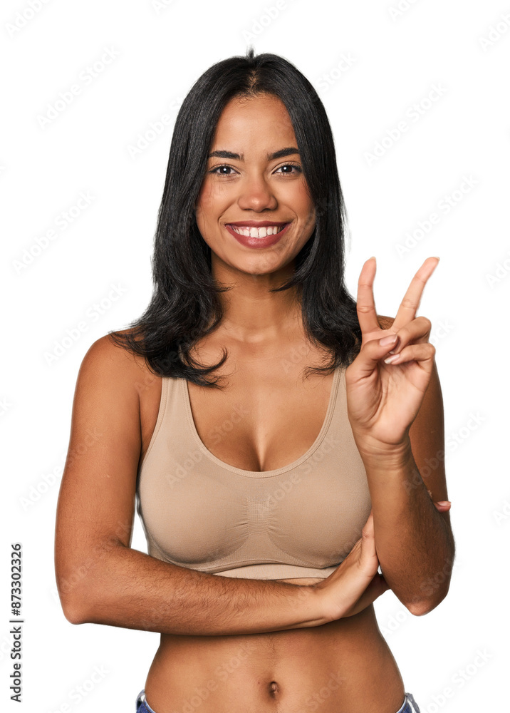 Young Filipino woman in light wear showing number two with fingers. Young Filipino woman in light wear showing number two with fingers.