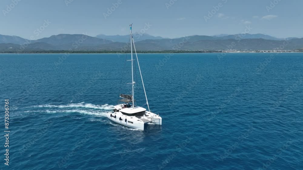 Aerial view of a moored yacht boat in beautiful calm sea bay with turquoise water near Fethiye, Turkey. Full circle around luxury Aerial view of a moored yacht boat in beautiful calm sea bay with turquoise water near Fethiye, Turkey. Full circle around luxury
