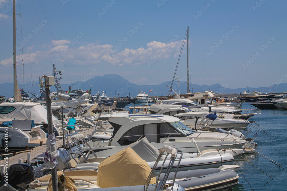 Fototapeta premium Boats in the marina. Beautiful white yachts parked on the sea coast, Naples, Italy