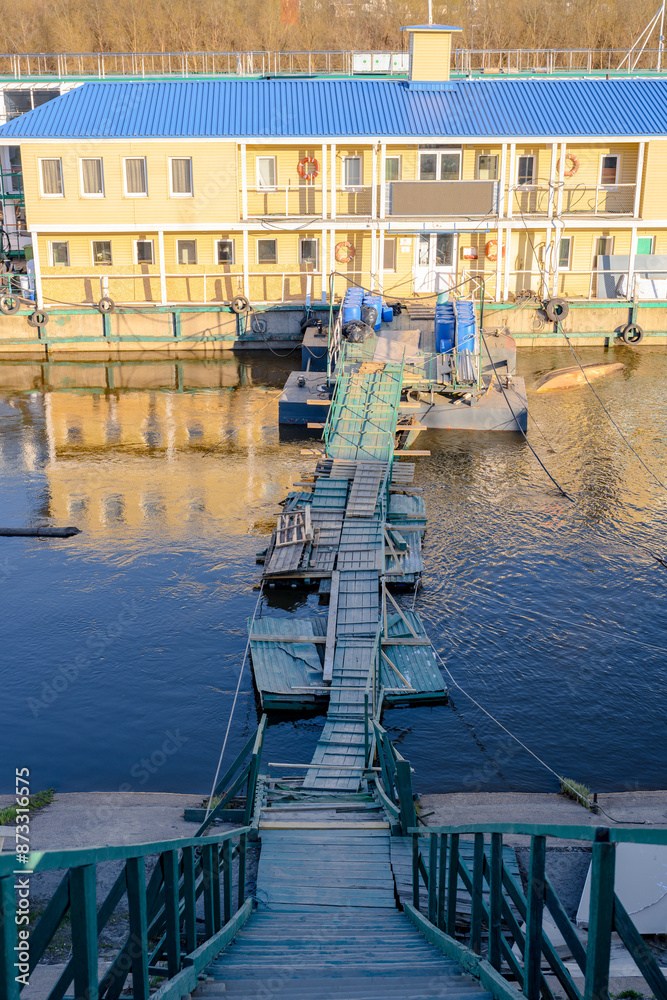Fototapeta premium Wooden floating bridge on the Oka River in Nizhny Novgorod at sunset