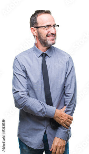 Middle age hoary senior business man wearing glasses over isolated background looking away to side with smile on face, natural expression. Laughing confident.