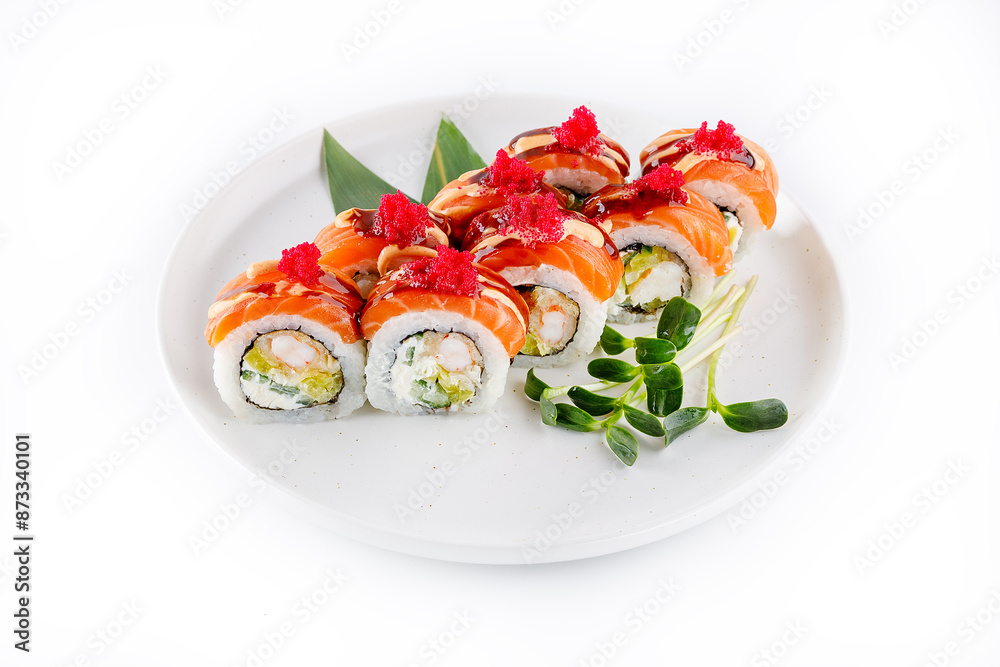 Sushi roll with salmon and tempura shrimp drizzled with unagi sauce and tobiko caviar Sushi roll with salmon and tempura shrimp drizzled with unagi sauce and tobiko caviar