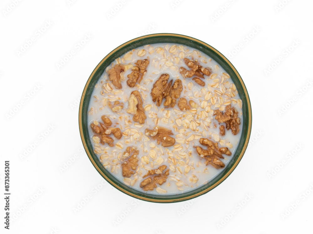 Delicious nutritious and healthy fresh old fashioned oatmeal on white background , top view Delicious nutritious and healthy fresh old fashioned oatmeal on white background , top view