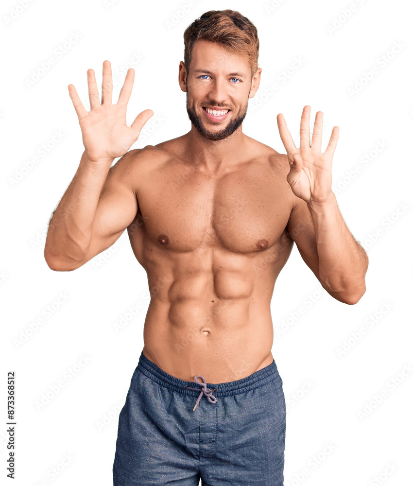 Young caucasian man standing shirtless showing and pointing up with fingers number nine while smiling confident and happy. Young caucasian man standing shirtless showing and pointing up with fingers number nine while smiling confident and happy.