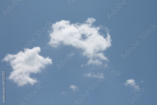 Clouds in a blue sky ,white fluffy clouds on a back ground of blue sky on a summers day Knottingley West Yorkshire In UK
 photo
