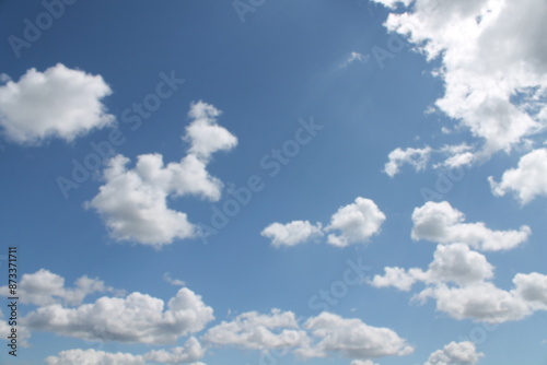 Clouds in a blue sky ,white fluffy clouds on a back ground of blue sky on a summers day Knottingley West Yorkshire In UK
 photo